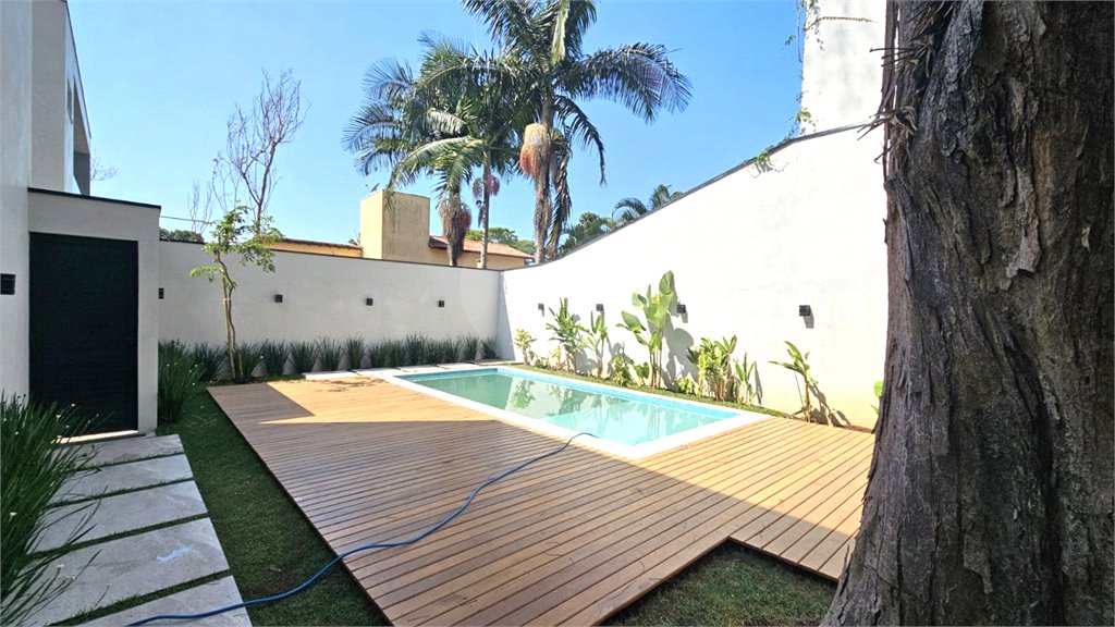 Casa à venda com 4 suítes no condomínio Villa Suiça, São Paulo - SP