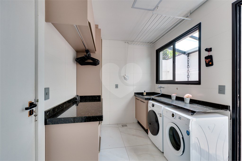 Casa à venda com 4 suítes no condomínio Villa Suiça, São Paulo - SP