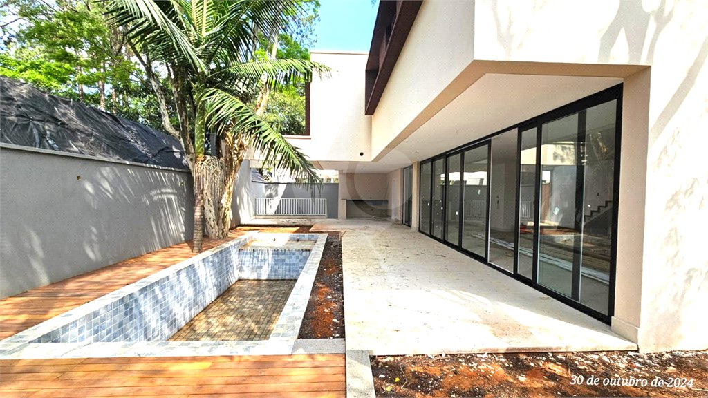 Casa à venda com 4 suítes no condomínio Garda, São Paulo - SP