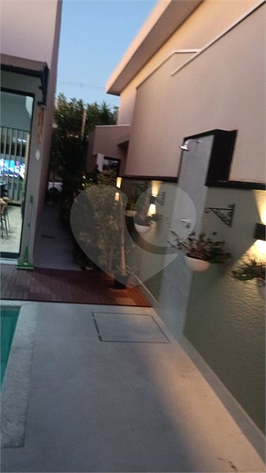 Casa à venda com 4 suítes no condomínio Sta Morriz, Campinas - SP