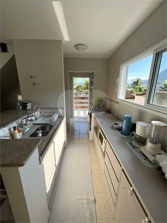 Casa à venda com 2 suítes no condomínio Recanto da Lagoinha, Ubatuba - SP