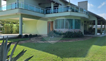 Casa à venda com 4 suítes no condomínio Bougainville, Peruíbe - SP