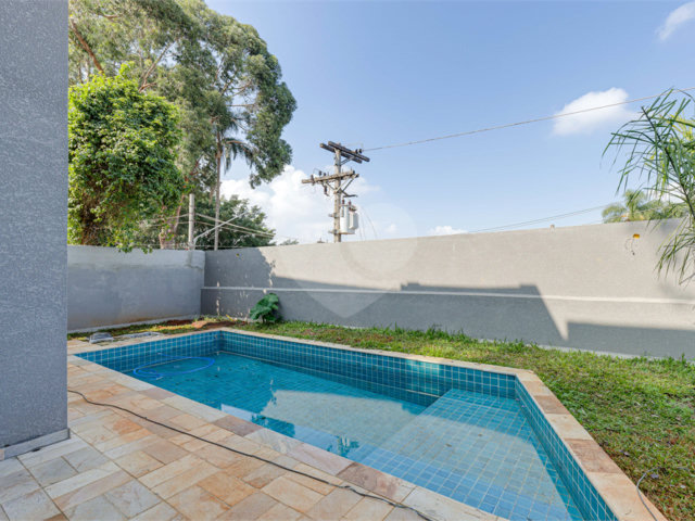 Casa à venda com 4 suítes no condomínio Reserva Robélia, São Paulo - SP