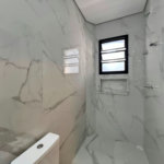 Sobrado com 4 dormitórios à venda, 234 m² por R$ 2.500.000,00 - Ponta da Praia - Santos/SP