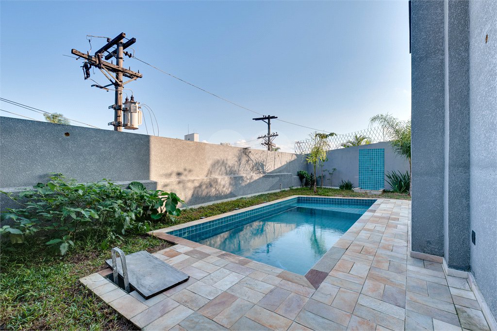 Casa à venda com 4 suítes no condomínio Reserva Robélia, São Paulo - SP