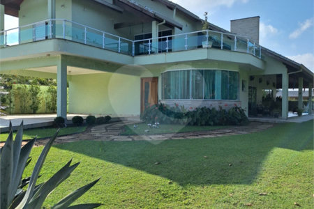 Casa à venda com 4 suítes no condomínio Bougainville, Peruíbe - SP