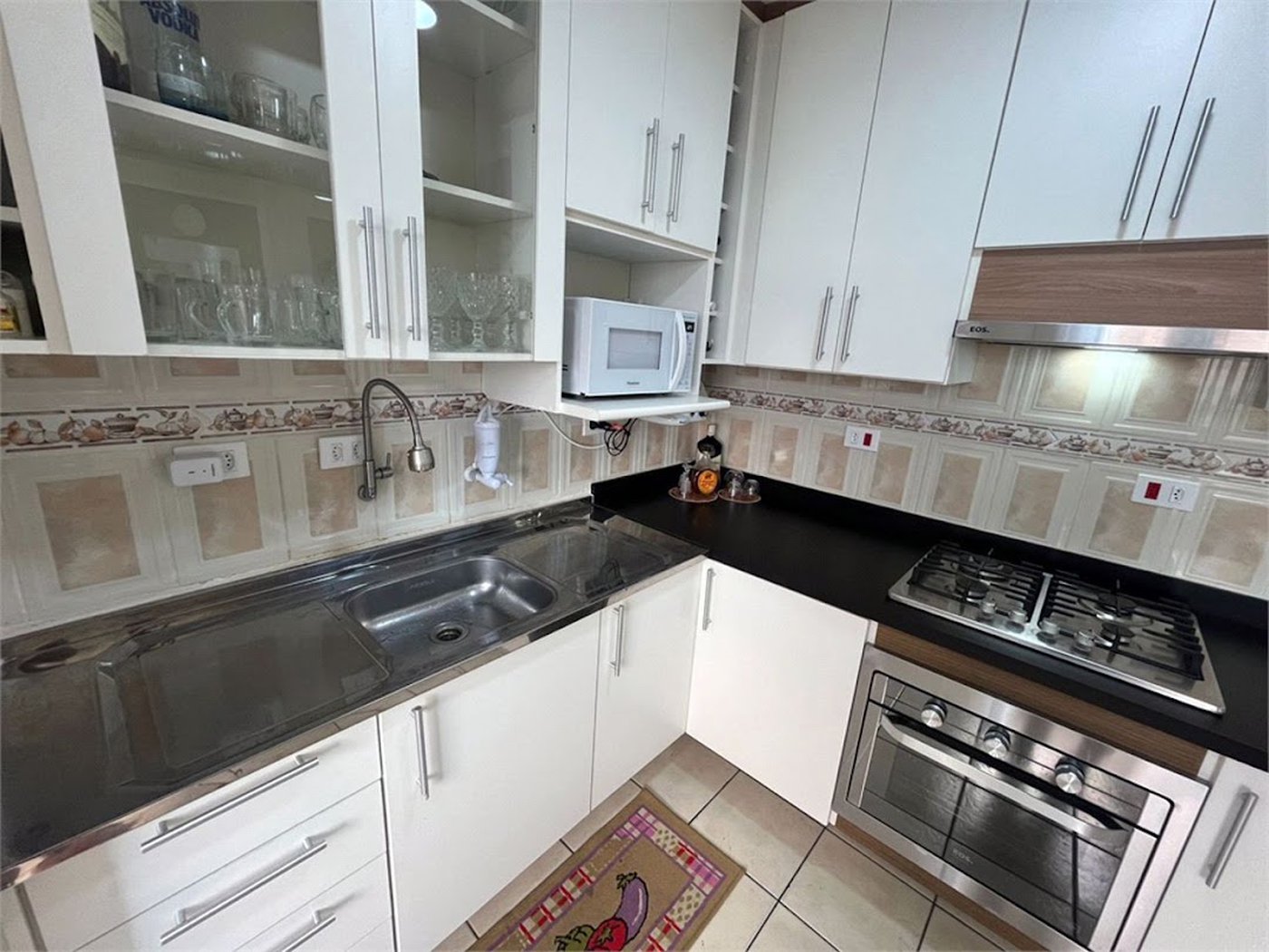 Apartamento com 2 dormitórios à venda, 64 m² por R$ 360.000,00 - Jardim Praiano - Guarujá/SP