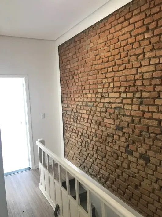 Casa com 3 dormitórios à venda, 116 m² por R$ 690.000,00 - Gonzaga - Santos/SP