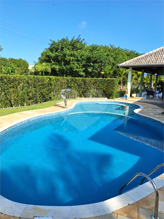 Casa à venda com 4 suítes no condomínio Bougainville, Peruíbe - SP