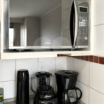 Apartamento á venda no centro com dois dormitórios e sacada.
