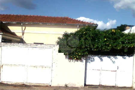 Terreno contendo 02 casas geminadas á venda.